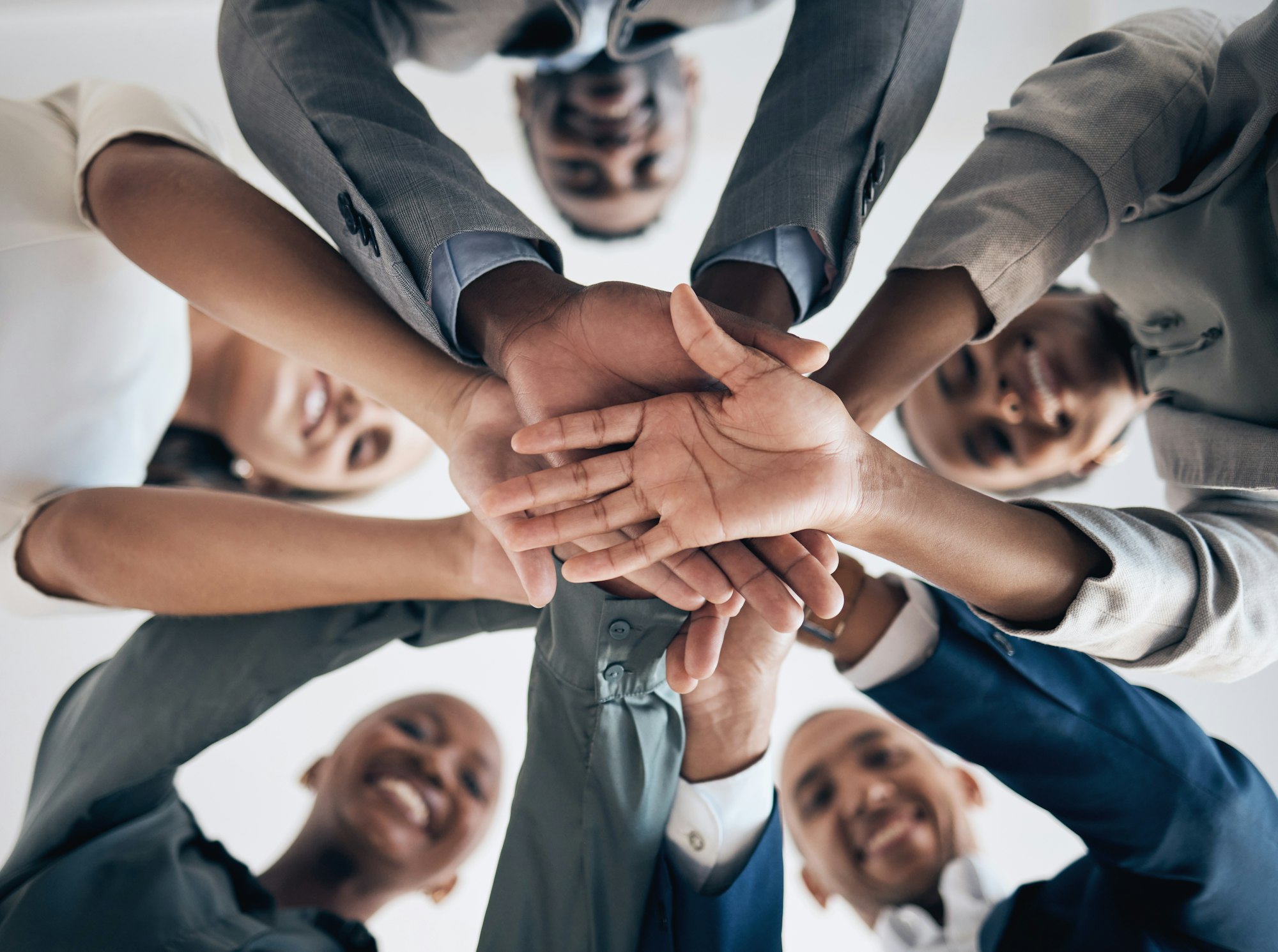 About us, partnership hands and business meeting with support, team building or teamwork in company