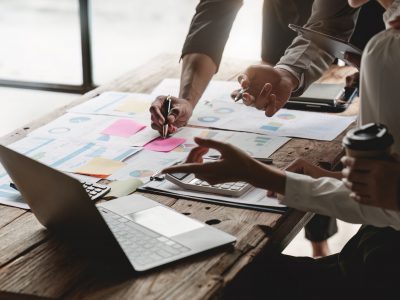 Group of ux developer and ui designer brainstorming about app interface design at modern office